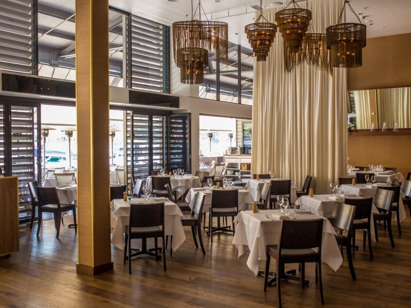 Manta restaurant woolloomooloo wharf sydney interiors brass chain- handeliers